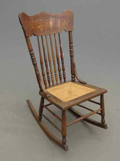 Appraisal: Victorian oak cane seat pressed back rocking chair '' Seat