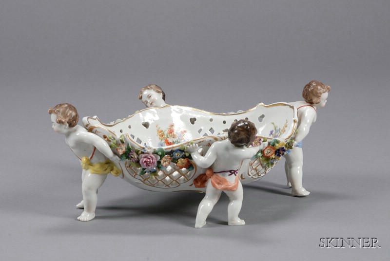 Appraisal: Porcelain Figural Fruit Basket Austria late th century gilt trim