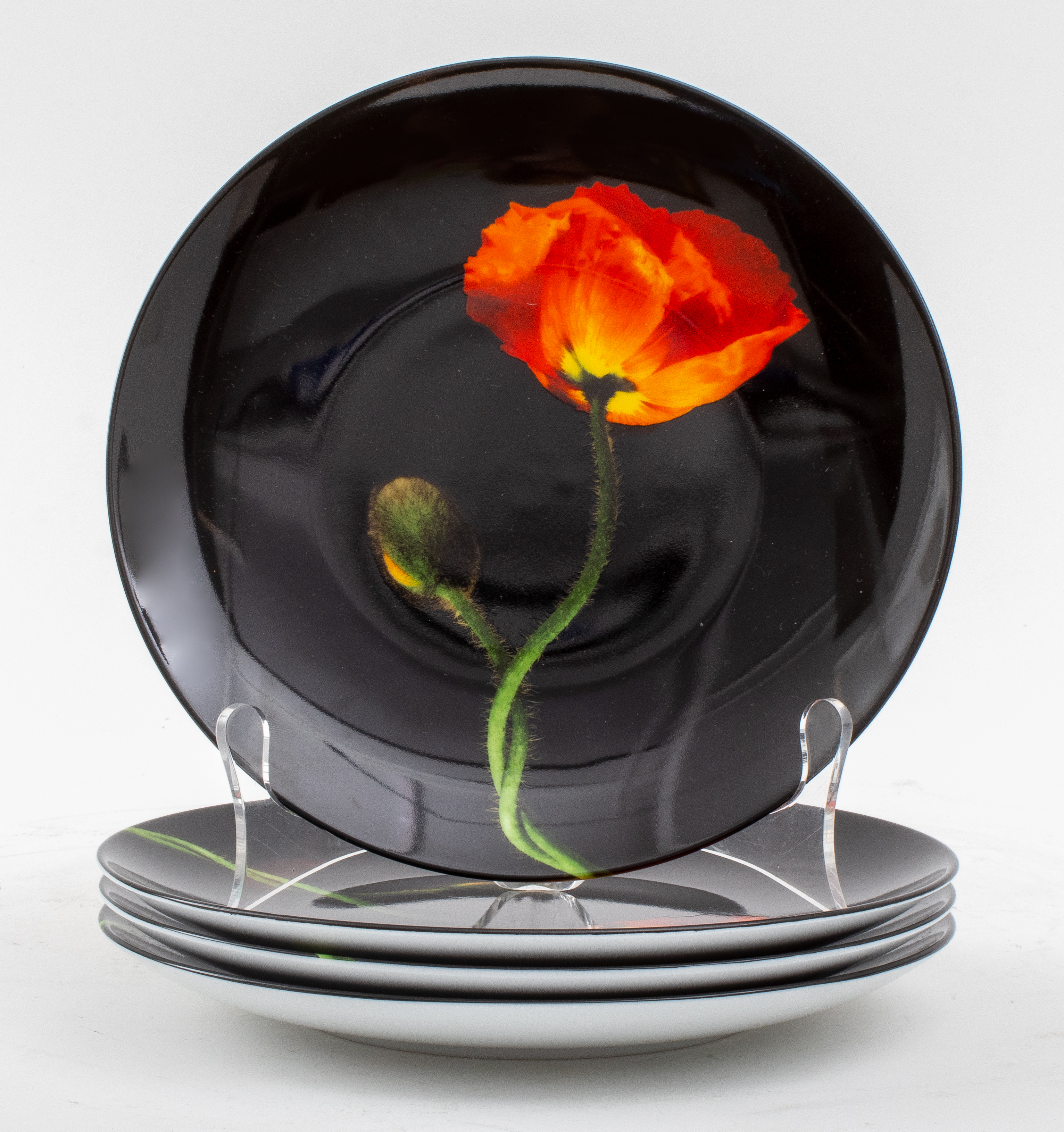 Appraisal: ROBERT MAPPLETHORPE FOR LIMOGES POPPY PLATES Set of four Robert