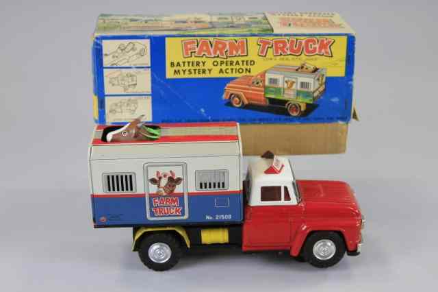 Appraisal: BOXED FARM TRUCK Alps Japan lithographed tin interesting toy features