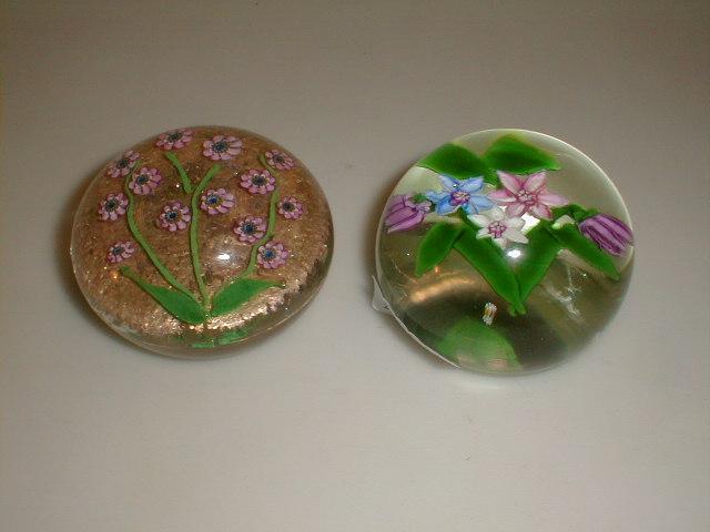 Appraisal: A floral paperweight dia together with a cane floral weight