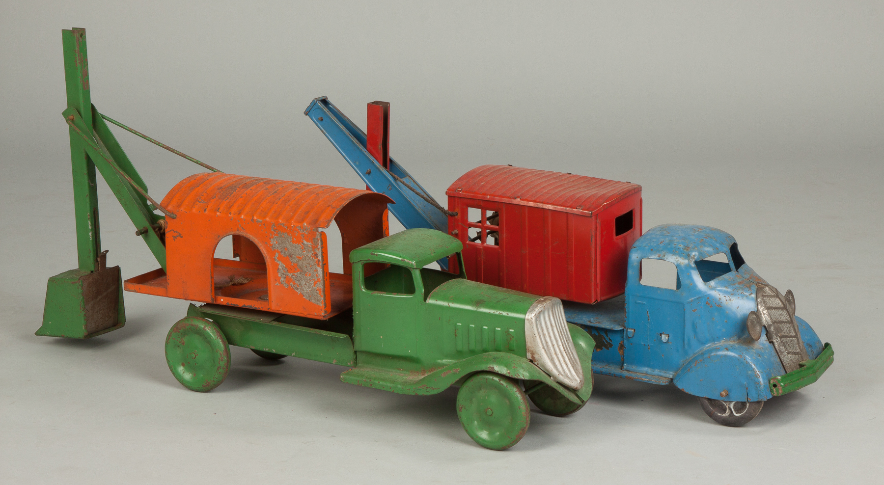 Appraisal: Vintage Painted Pressed Steel Backhoe Trucks