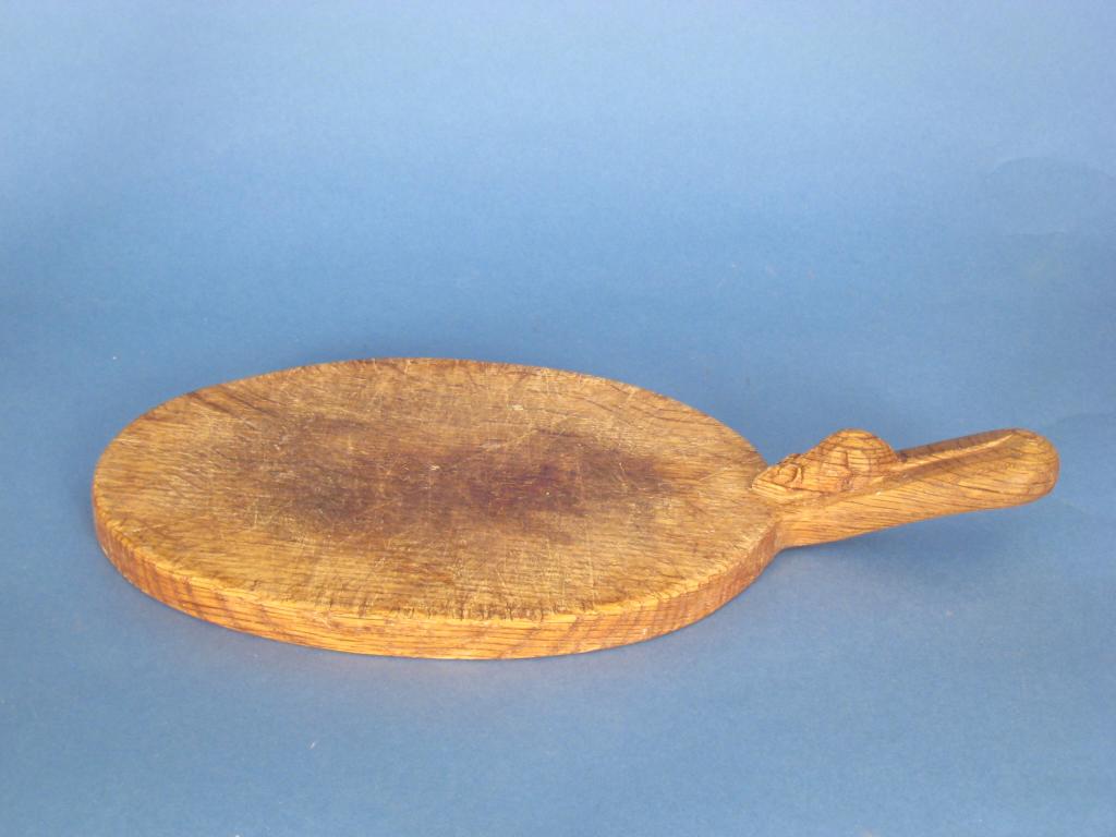 Appraisal: A Mouseman Thompson Cheeseboard of oval form in long