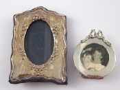 Appraisal: A small late Victorian circular photo frame with strut back