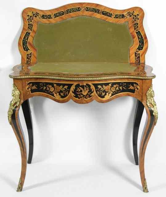 Appraisal: A Louis XV style serpentine marquetry card table inlaid a