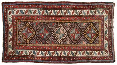 Appraisal: Kazak rug central rectangular panel with interlocking diamonds with hook