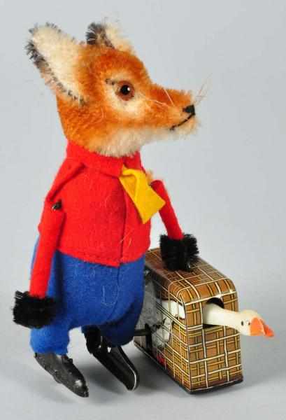 Appraisal: Schuco Fox Carrying Goose Wind-Up Toy Description German Working Felt