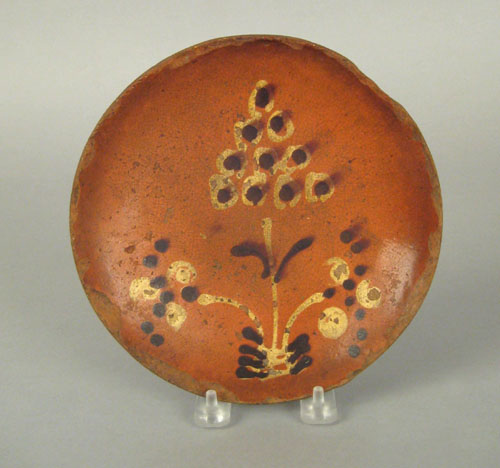 Appraisal: Pennsylvania redware pie plate th c with brown and yellow