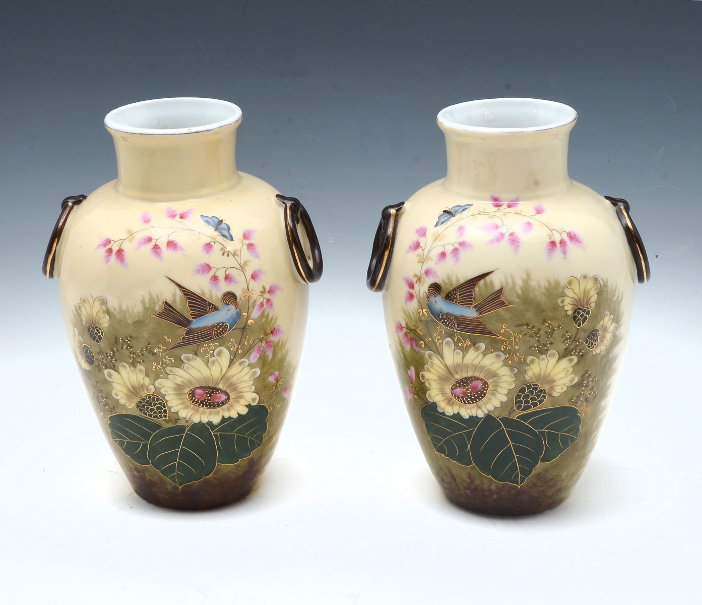 Appraisal: PAIR OF PAINTED OPPOSING PORCELAIN VASES painted porcelain vases having