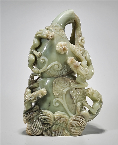 Appraisal: Large Chinese jade carving of chilong climbing along a gourd