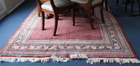 Appraisal: A Fereghan rug with extensive field of stylised botehs on