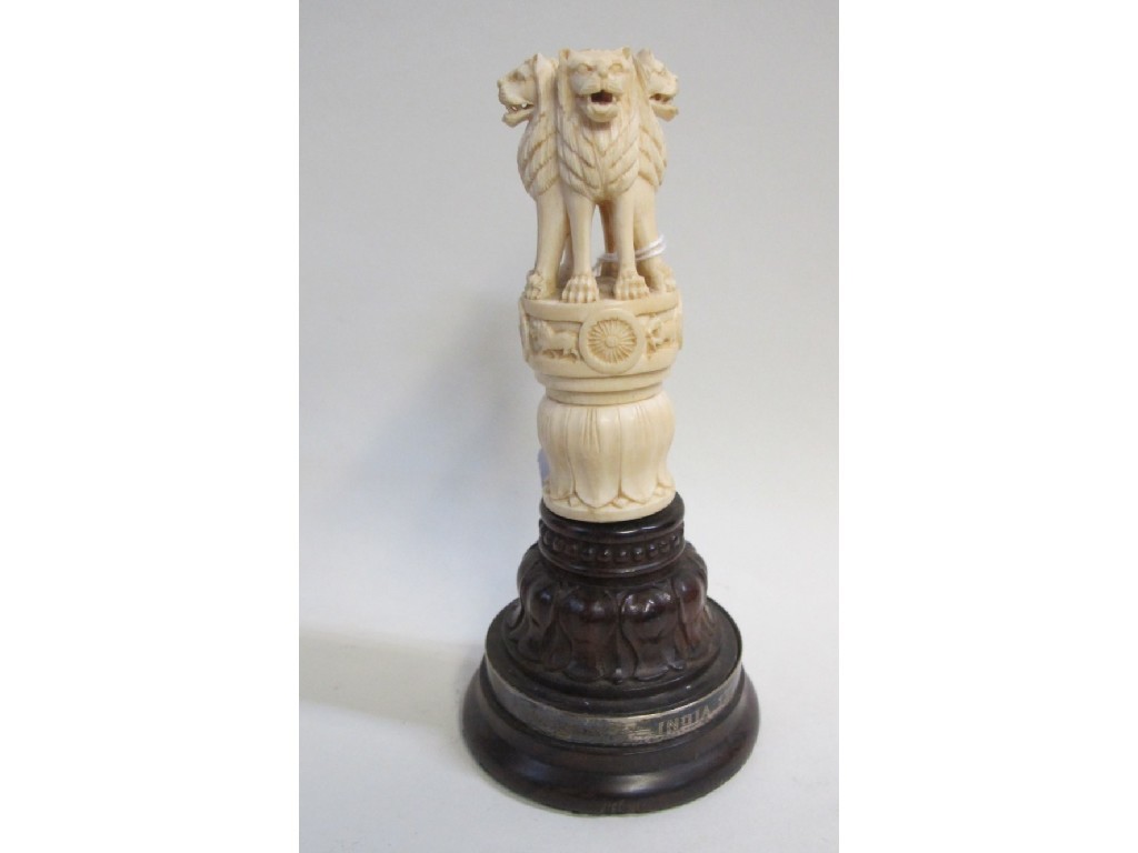 Appraisal: Carved ivory figure - four lion figures on a plinth