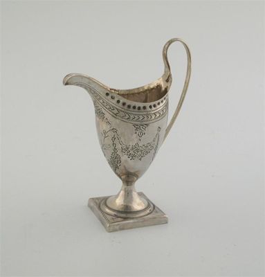 Appraisal: A George III bright engraved helmet cream jug on a