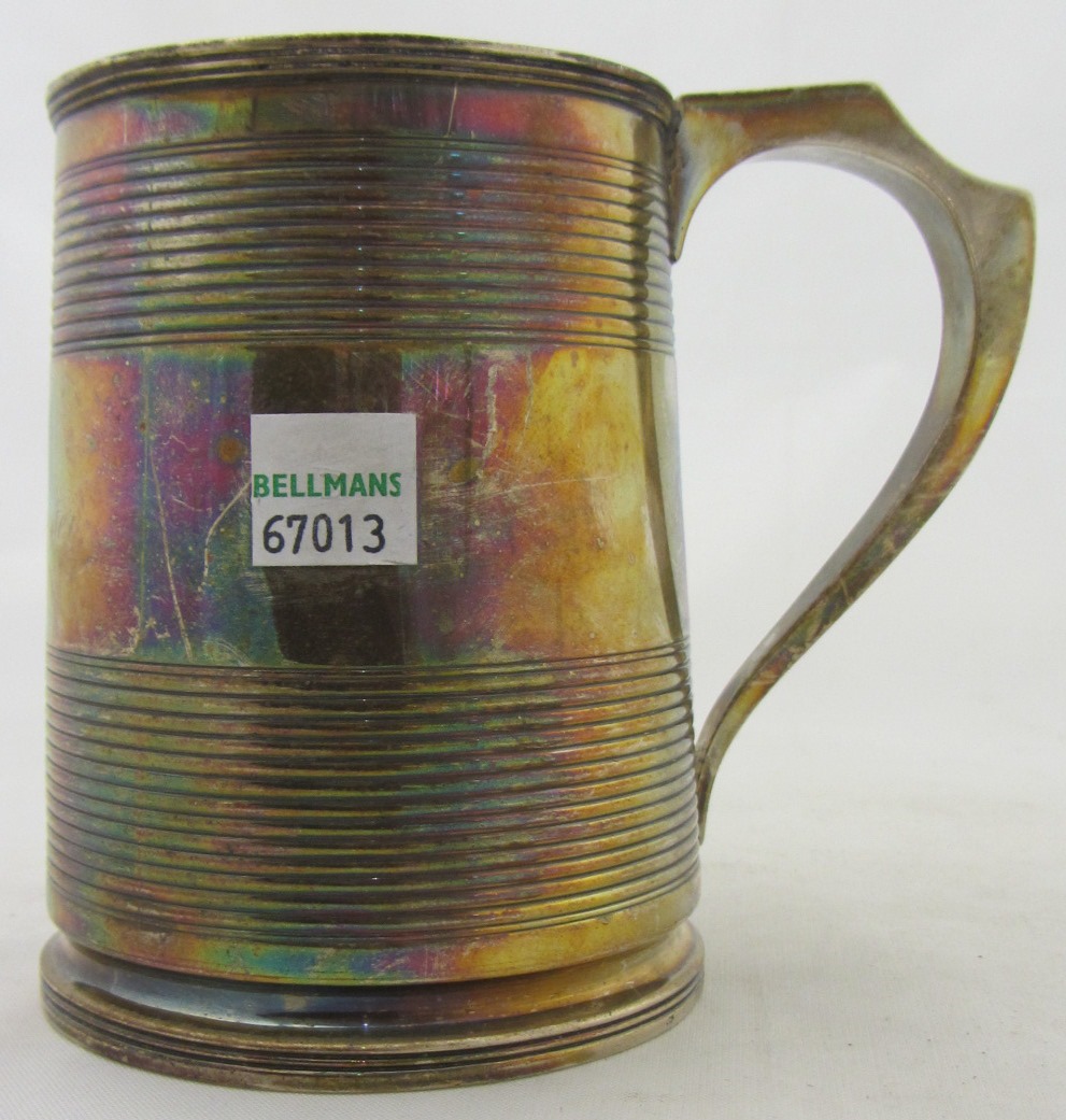 Appraisal: A George III silver mug of tapered cylindrical form decorated