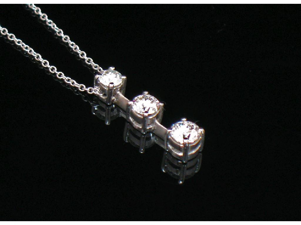 Appraisal: A DIAMOND PENDANT the unmarked white metal chain claw-set with