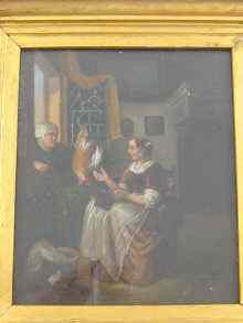 Appraisal: An oil on metal Dutch interior scene signed bottom right