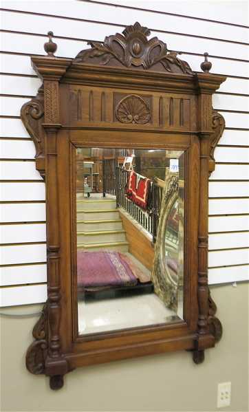 Appraisal: VERTICAL WALL MIRROR Continental late th century in carved wood