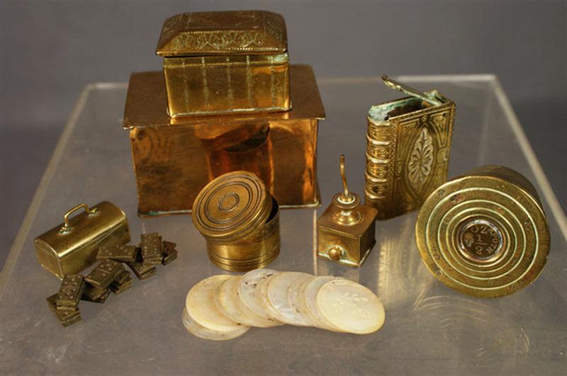 Appraisal: Miniature brass trunk with concealed dominoes set round brass box