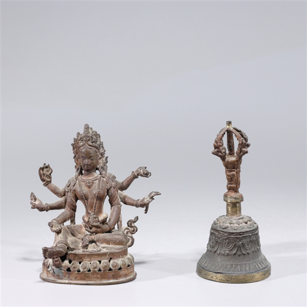 Appraisal: Two Sino-Tibetan bronzes including seated multi-armed deity together with bronze