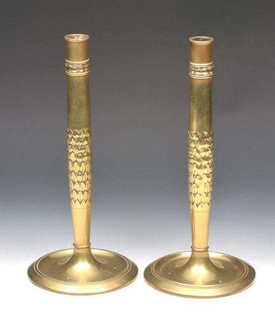 Appraisal: A PAIR OF ARTS AND CRAFTS BRASS COLUMN CANDLESTICKS each