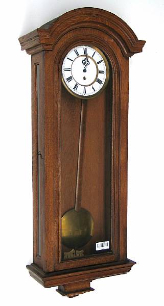 Appraisal: A German oak regulator clock early th century The enamel