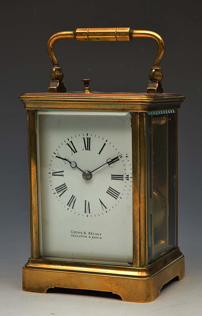 Appraisal: A FRENCH CARRIAGE CLOCK with white enamel Roman dial signed