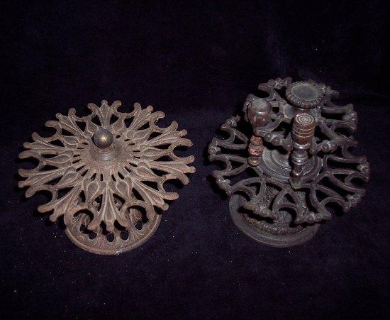 Appraisal: A cast iron desk top seal stand of two pierced