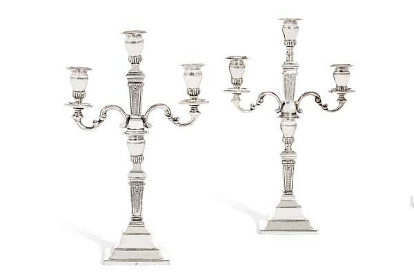 Appraisal: A pair of silver convertible candelabra A pair of standard