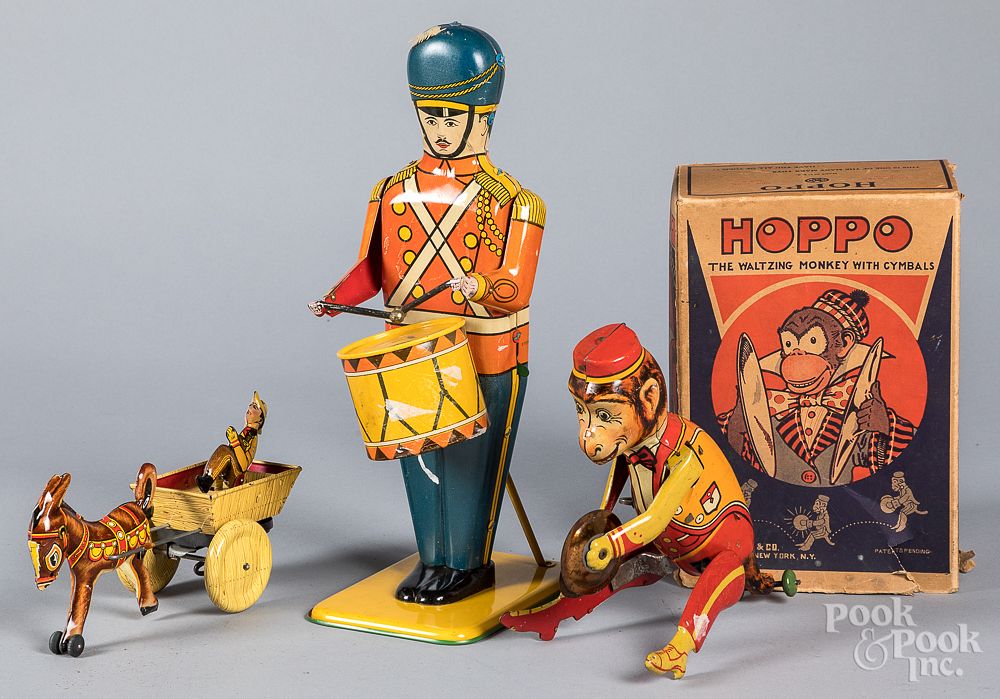 Appraisal: Three tin lithograph wind-up toys Three tin lithograph wind-up toys