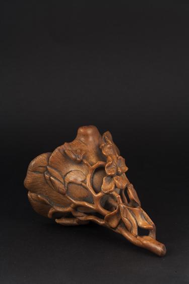 Appraisal: A CHINESE RHINOCEROS HORN LIBATION CUP carved as a magnolia