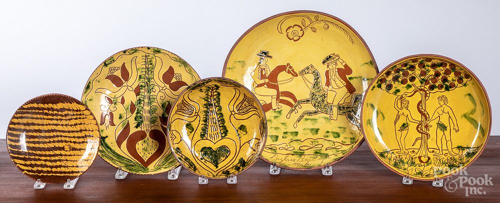 Appraisal: Five Breininger redware plates and chargers Five Breininger redware plates