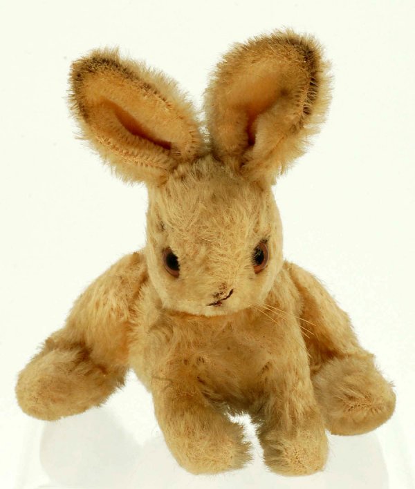 Appraisal: A small golden mohair rabbit Center seam stitched mouth No