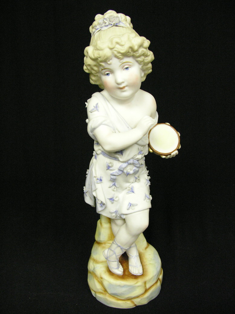 Appraisal: GERMAN BISQUE FIGURINE Young girl playing tambourine Applied flowers to