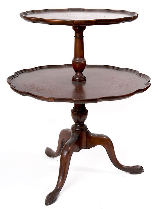 Appraisal: Pie Crust Tier Table A two tier mahogany table with