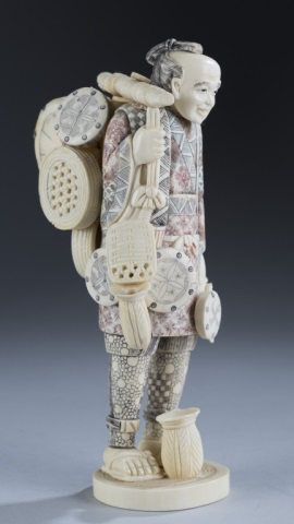 Appraisal: Carved Ivory or Bone Figure Man carrying numerous cooking vessels