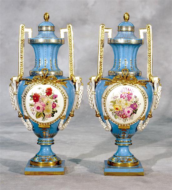 Appraisal: Pair Sevres type porcelain covered urns decorated with cartouches of