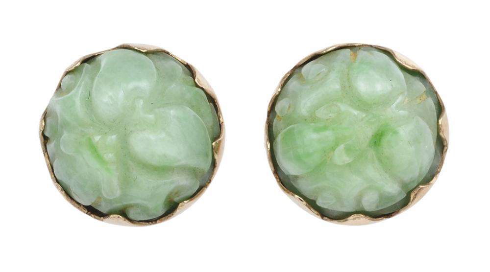 Appraisal: A PAIR OF JADE EARRINGS The carved jade to enclosed