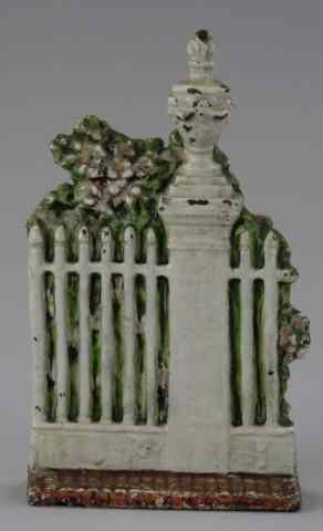 Appraisal: SARAH SYMONDS GATE WITH FLOWERS DOORSTOP Cast iron white fence