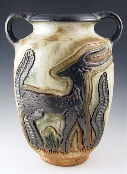 Appraisal: JULES GUERIN ART POTTERY VASE Deeply incised stylized antelope design