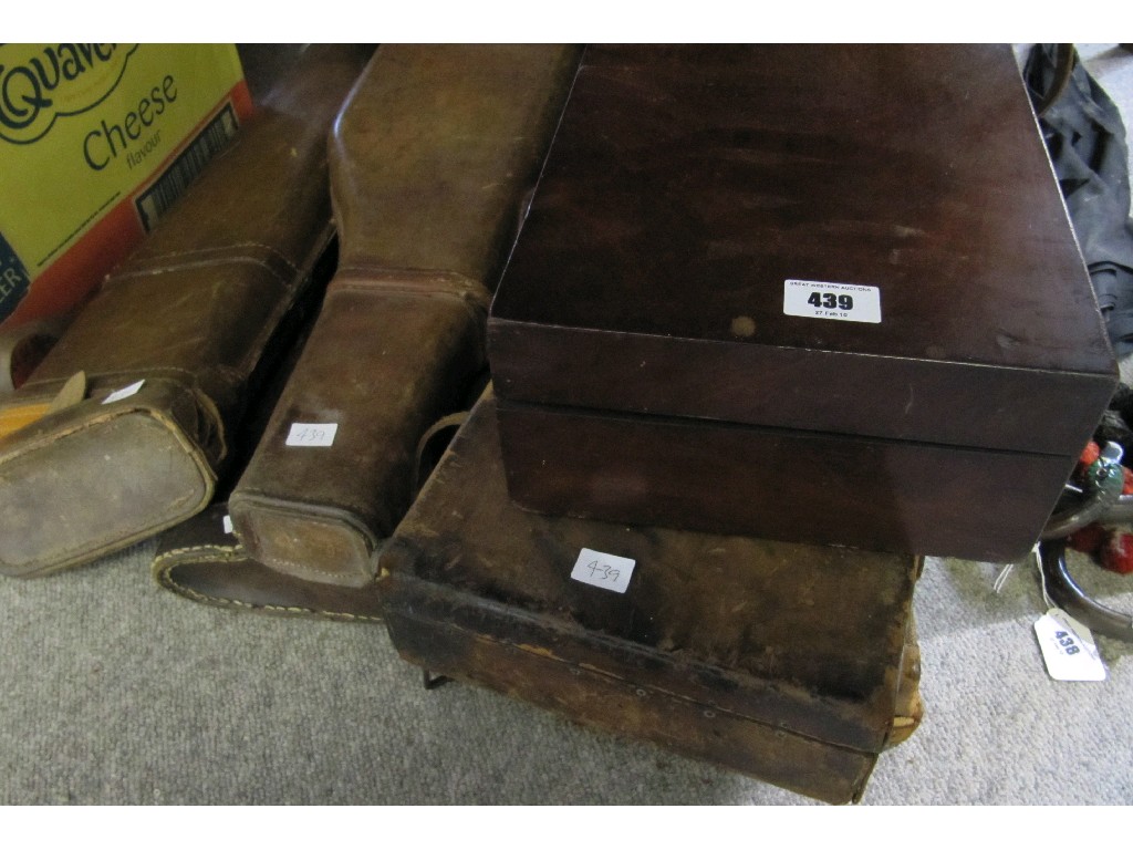 Appraisal: Lot comprising one mahogany and five leather gun cases