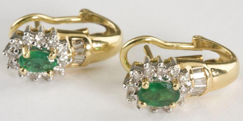 Appraisal: KT Emerald and Diamond Earclips consisting of two oval emeralds