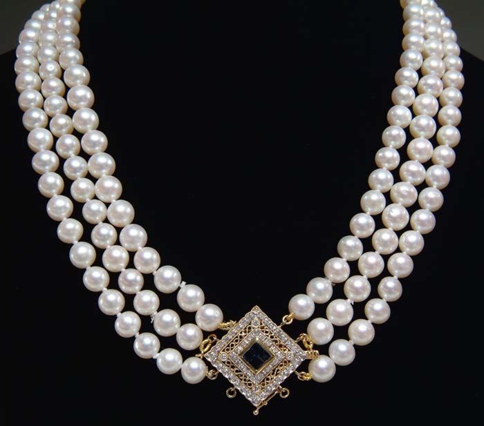 Appraisal: THREE STRAND PEARL NECKLACE Lovely three row nest of cultured