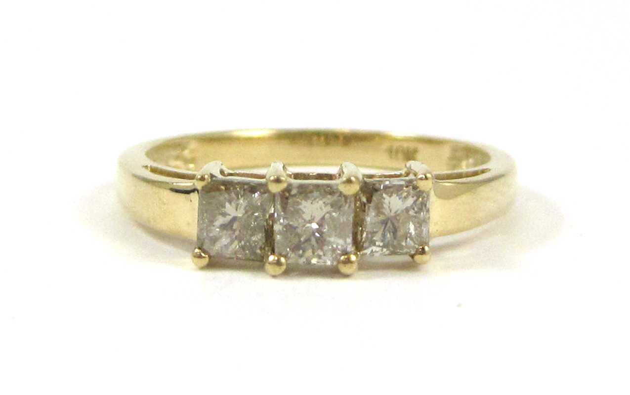 Appraisal: THREE STONE DIAMOND AND FOURTEEN KARAT GOLD RING set with