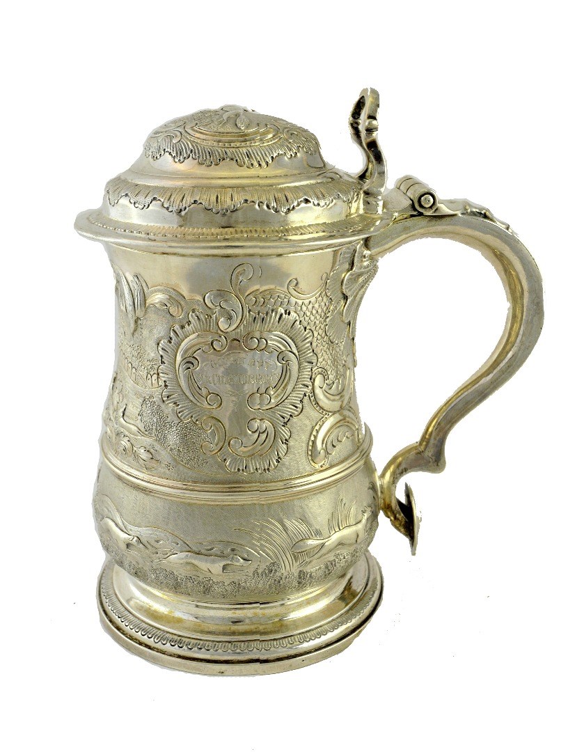 Appraisal: A George II silver hinge lidded tankard of baluster form