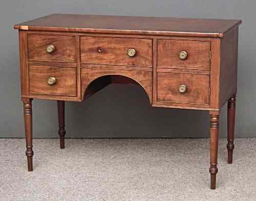 Appraisal: A George IV figured mahogany sideboard with crossbanded top fitted