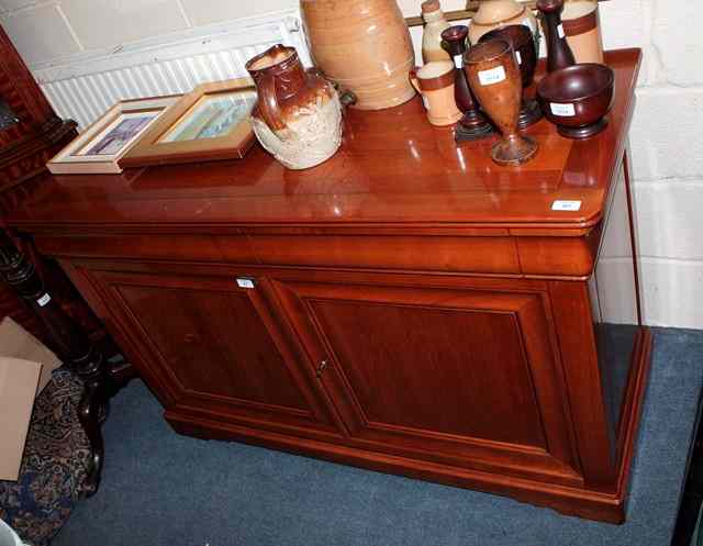 Appraisal: A CONTINENTAL MAPLE WOOD SIDE CABINET with two moulded frieze