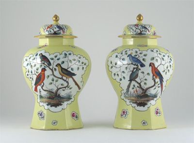 Appraisal: A pair of Continental porcelain yellow ground vases and covers