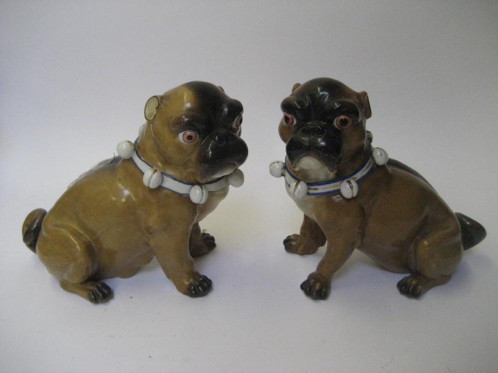 Appraisal: A PAIR OF GERMAN PORCELAIN MODELS OF PUGS late th