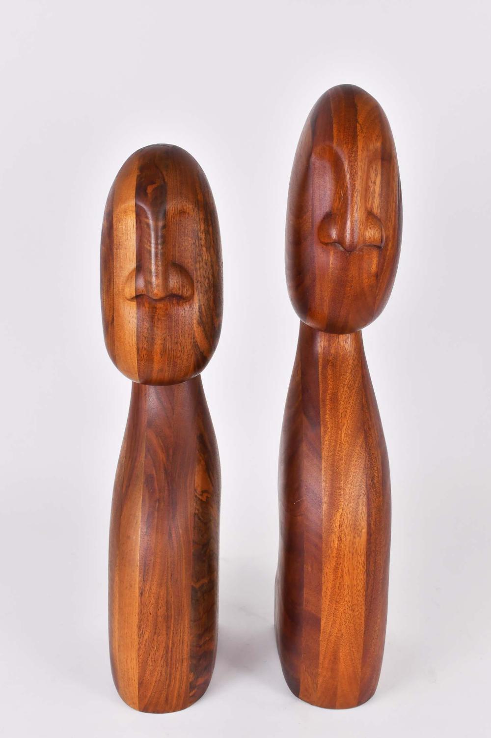 Appraisal: PAIR OF DANISH WALNUT MALE FEMALE WOOD CARVINGSCirca Each stylized