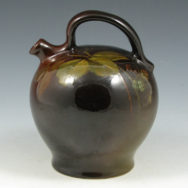 Appraisal: Weller Louwelsa jug with berry decoration under standard glaze signed